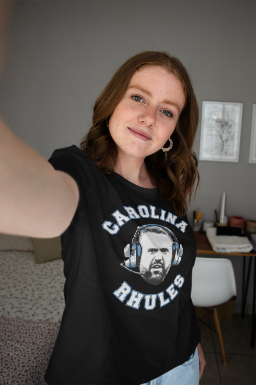 selfie-mockup-of-a-woman-wearing-a-round-neck-t-shirt-in-her-bedroom-36765.png